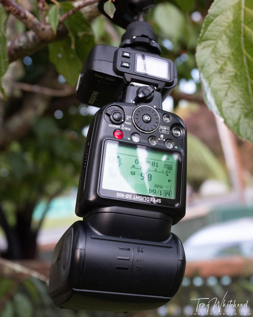 Photo showing remote Nikon SB900 flash with Godox X1R-N wireless flash trigger. Flash set manually to 1/64 intensity