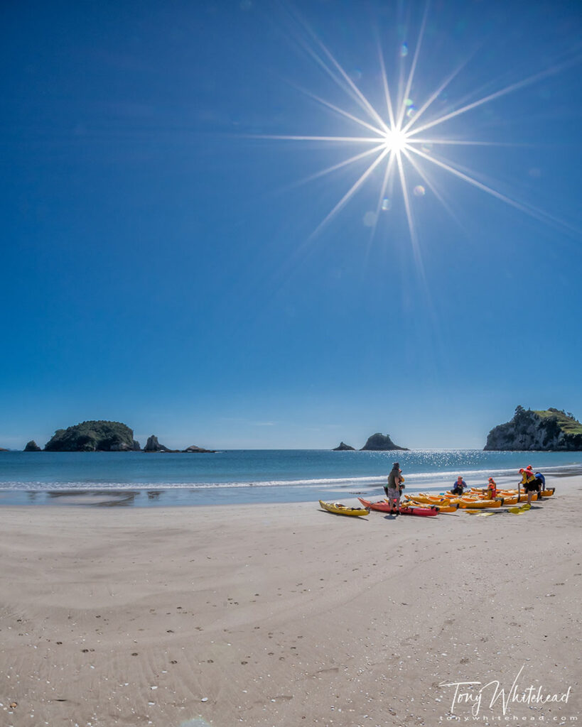 Photo of a kayaking group preparing for a day on the water at Hahei